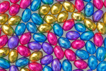 Fototapeta na wymiar beautiful coloured chocolate easter eggs on white