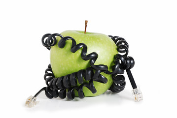 Green apple tied around with wire