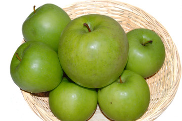 Green apple's in the basket on the white background