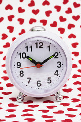 Clock on heart background – waiting for love
