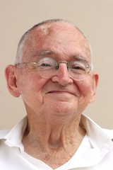 happy senior man sitting and smiling