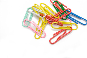 multicolored paper-clip on the white isolated background