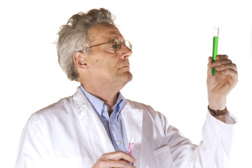 man is analyzing liquids in the laboratory