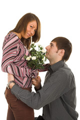 young man giving flower to darling girl