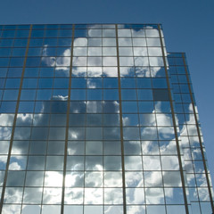 Clouds & sun reflected in windows