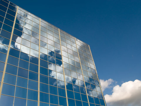 Clouds reflected in office windows