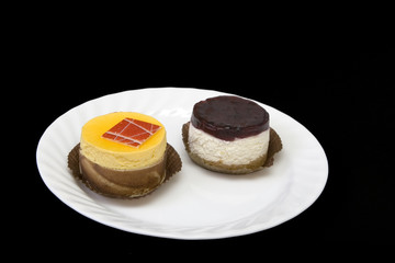 fancy cakes on the white plate