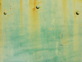 rusty green metal with rivets