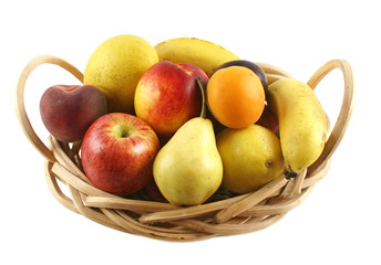 Cane basket filled with freshly picked colorful organic fruit.