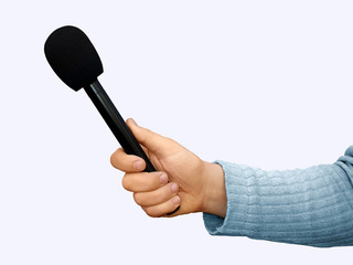 Hand with a professional handheld microphone