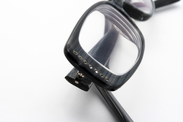 Black eyeglasses on white background