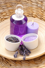 Obraz na płótnie Canvas aromatic lavender bath - bath salt bath gel and lavender flowers