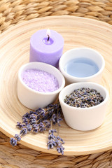 Fototapeta na wymiar aromatic lavender bath - bath salt bath gel and lavender flowers