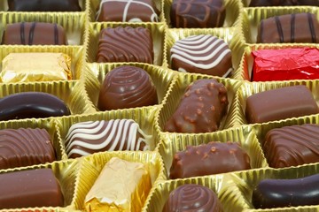 Chocolates in a golden box as a gift