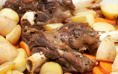 Marinated lamb shanks on the bone cooked with potatoes
