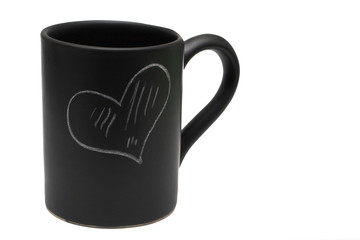 Black coffee cup with chalk drawing of heart on white