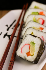 California Spring Rolls on a japanese plate with chopsticks