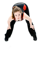 A young caucasian girl doing different stretches