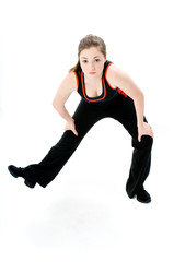 A young caucasian girl doing different stretches