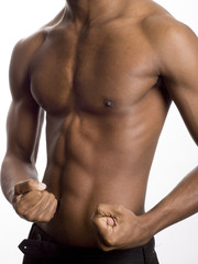 Fototapeta na wymiar a muscular model is posing against white background