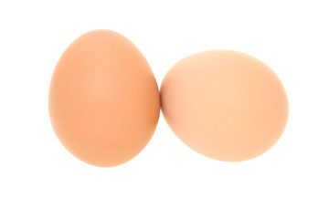 Two fresh brown eggs isolated on white