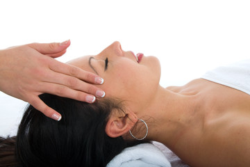 Obraz na płótnie Canvas masseuse does relax facial massage to the girl