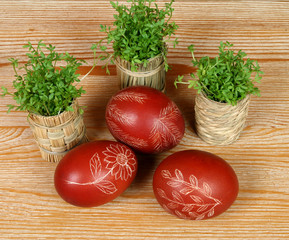 Ornate, traditional decorated Easter eggs and green cress