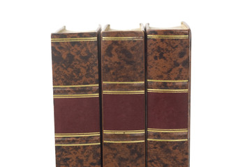 Row of three old books isolated