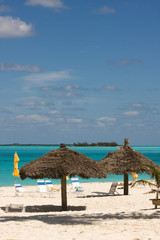 thatched sunshade on a tropical beach in the Bahamas