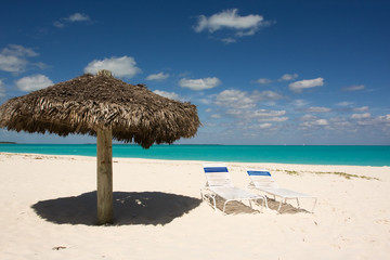 thatched sunshade on a tropical beach in the Bahamas