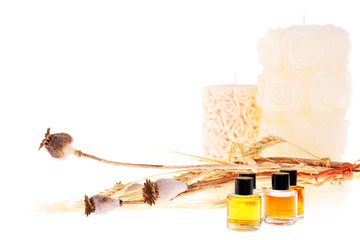 aromatherapy oils, candles and dried poppies. 