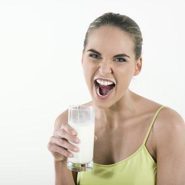 beautiful caucasian woman drinking milk