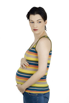 Young female in thrid trimester of pregnancy.