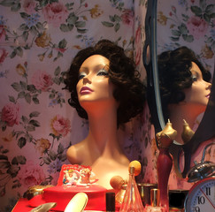 Retro Still Life of Mannequin with Wig on Vanity in Bedroom