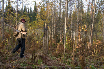 The hunter on hunting in an autumn wood