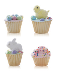 Colorful cute Easter cupcakes over a white background