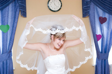 bride looks from the veil