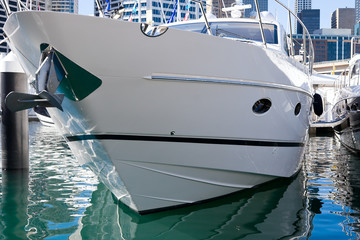 A moored luxury boat in a marina
