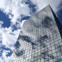 reflection of clouds on skyscraper