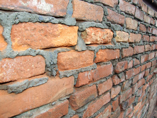 old brick wall with half distroyed brick