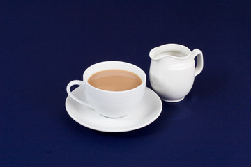 A cup of tea and milk jug