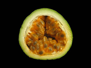 Passion fruit cross section isolated on black backgound