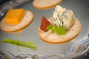 Gourmet cheese and biscuits on a silver salver