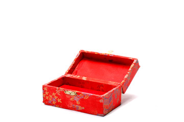 A small patterned box, with a metal clasp, over white.