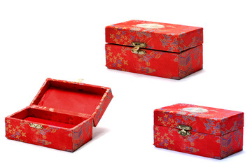 A small patterned box, with a metal clasp, three angles.