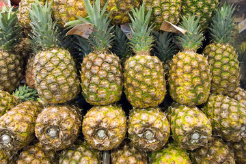Group of pineapple at public market in Barcelona, Spain.