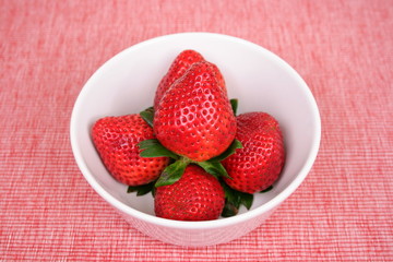 strawberries  on red placemat