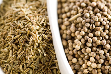 Closeup of cumin and koriander seeds