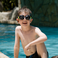 Boy at swimming pool on holiday