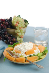 Fototapeta na wymiar Plate of fruit salad on a bed of lettuce